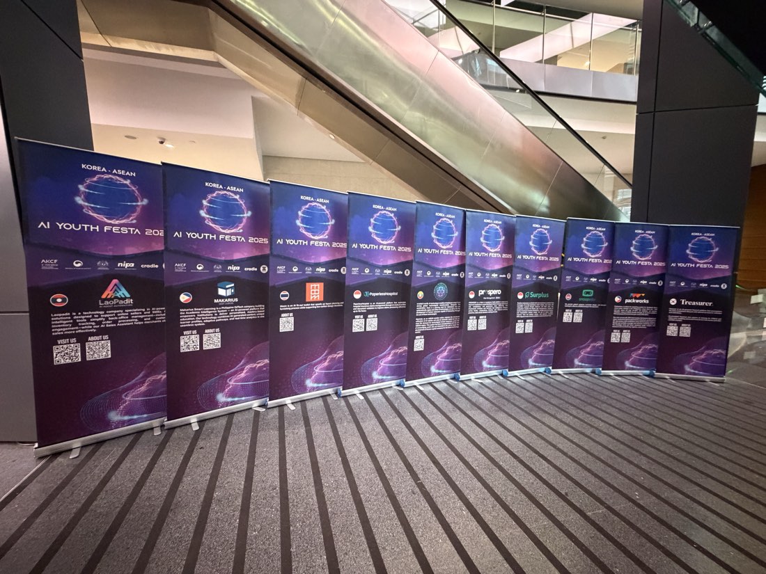 Banners of the selected AI startups lined up at the venue
